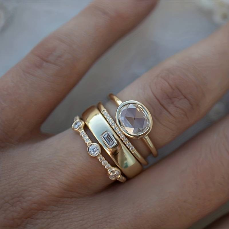 Set di Anelli Dorati con Zirconi
